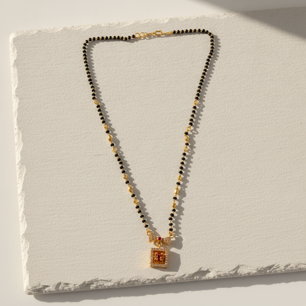 Elegant Black Bead Mangalsutra with Sparkling CZ Bow and Ruby Pendant